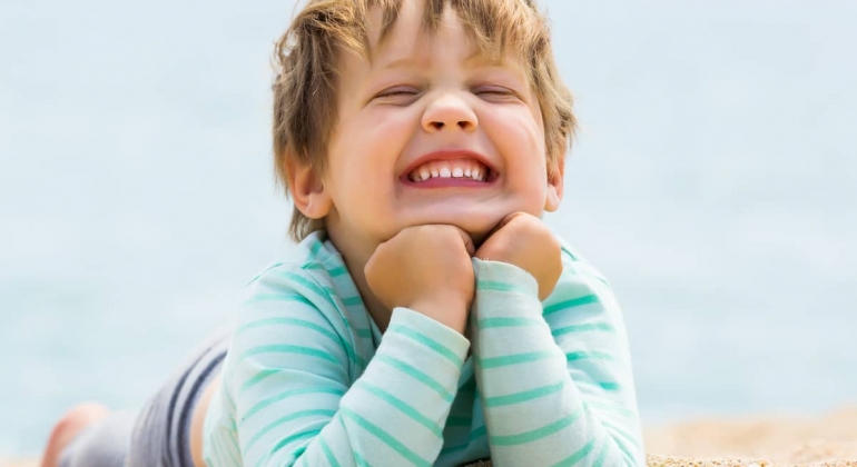 Happy-toddler-on-the-beach-gentle-healing